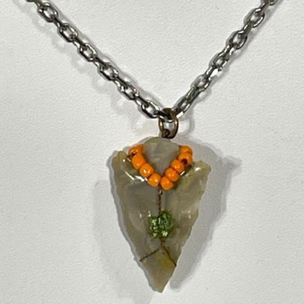 Arrowhead and beaded pendant on silver-tone chain. Reversible design.